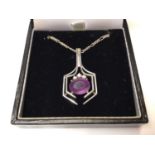 18ct white gold diamond and amethyst pendant on a silver chain.