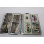 Postcards in two album including interesting postmarks and back stamps, GB topography, street scenes