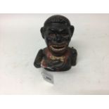 Early 20th century cast iron mechanical novelty money box/bank in the form of a gentleman in a black