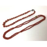 Two antique coral bead necklaces