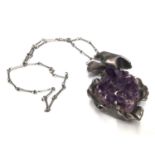 Abstract silver and raw amethyst pendant on chain