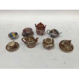 Group of miniature Japanese ceramics, including Satsuma and Imari teapots