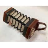 Victorian concertina by Butler of Haymarket, London, with fretwork ends and ivory buttons