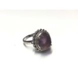 White gold (stamped 585) purple stone cocktail ring