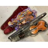 Two antique violins in cases