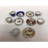 Group of miniature Meissen and Dresden cups and saucers, including floral encrusted examples