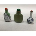 Three Chinese snuff bottles, including porcelain, glass and stone