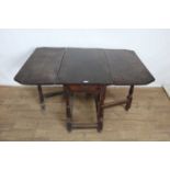 18th century oak drop-flap gateleg table with turned supports joined by stretchers, 94cm wide
