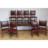 Oak dining table and a set of 8 oak dining chairs with red leather upholstery