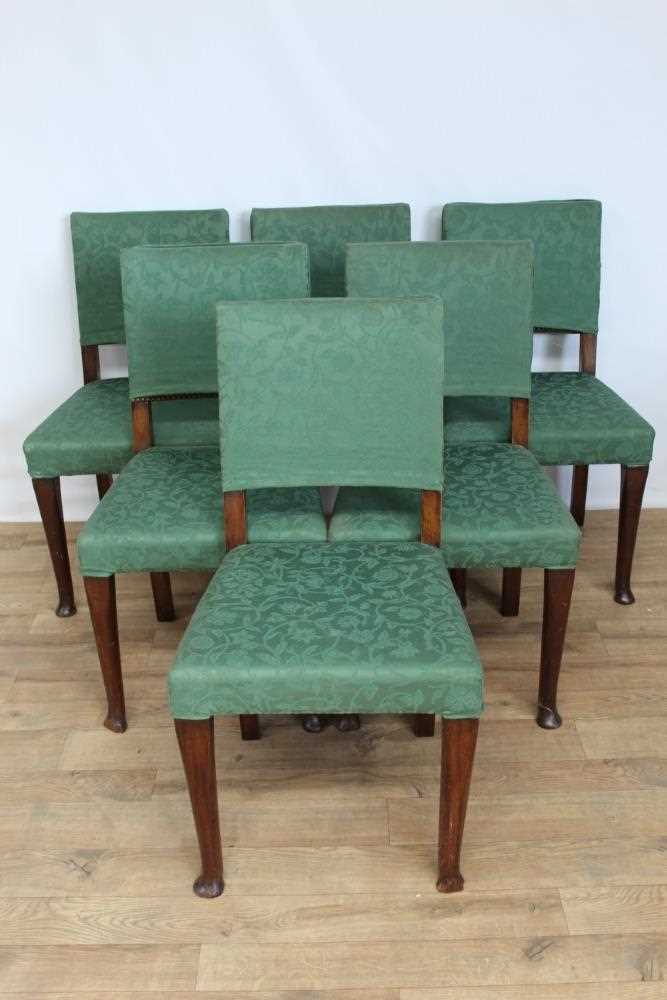 Set of six dining chairs with loose green covers