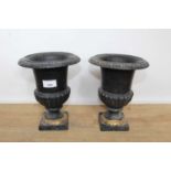 Pair of Victorian-style black and gilt painted cast iron planters, 23cm high