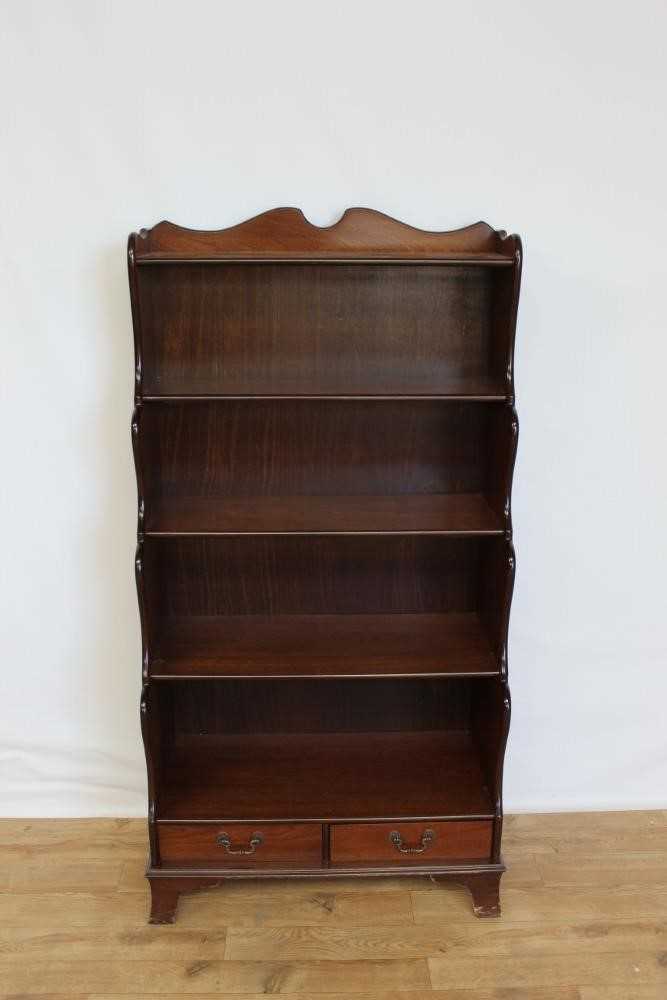 Mahogany waterfall bookcase with two drawers below, 76cm wide, 38.5cm deep, 152cm high