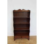 Mahogany waterfall bookcase with two drawers below, 76cm wide, 38.5cm deep, 152cm high