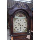 Early 19th century 8 day long case clock with arched painted dial, in stained pine case