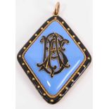 Victorian gold and enamel mourning pendant with applied black enamel monogram on lavender blue groun