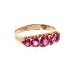 Late Victorian ruby five stone ring with five oval mixed cut rubies in gold claw setting. Ring size