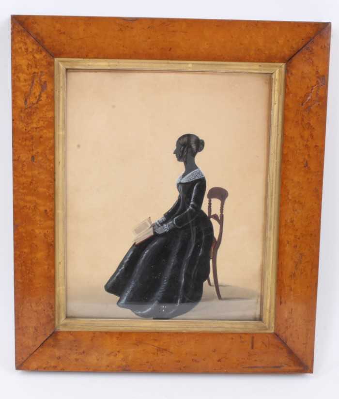 Regency silhouette portrait of a lady seated in profile.