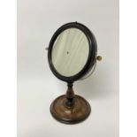 An early 19th century adjustable dressing table mirror