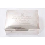 George V silver cigarette box of rectangular form, with engraved presentation inscription 'West Hert