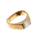 Diamond single stone ring with a rectangular emerald cut diamond in 18ct yellow gold setting