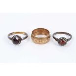 Two garnet rings and a 9ct gold wedding ring (3)