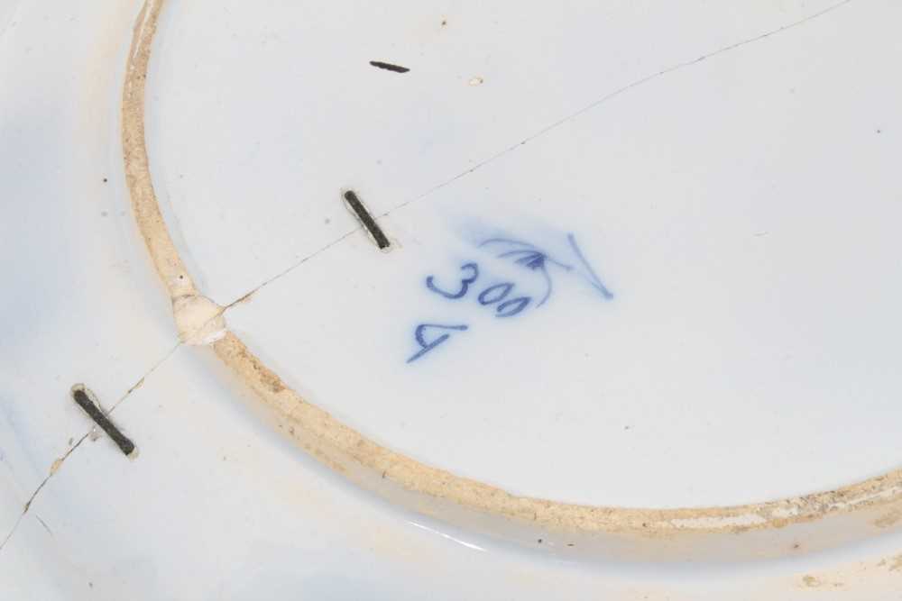 Two 18th century blue and white Dutch delftware dishes, one painted with the Peacock pattern, the ot - Image 5 of 5