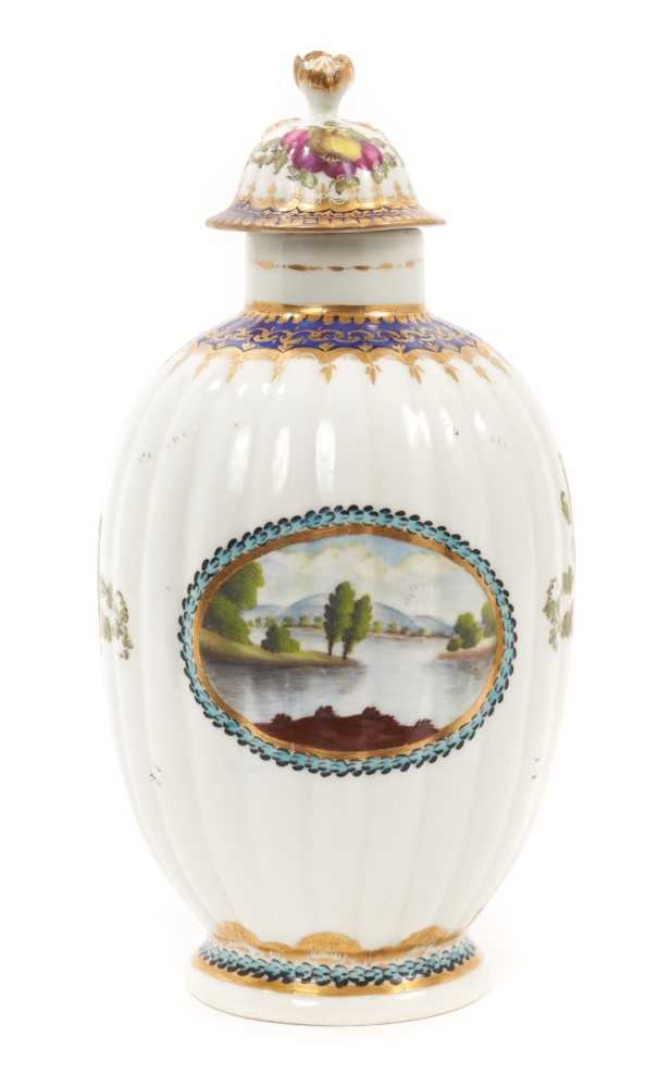 A Worcester fluted porcelain tea caddy and cover, circa 1780, of Dalhousie type, painted with a land