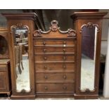 William IV mahogany wardrobe with mother of pearl inlaid handles, six central graduated drawers fl