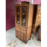 Chinese hardwood narrow display cabinet with glazed upper section above twin cupboards and drawers b