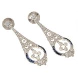 Pair of Edwardian style diamond and sapphire pendant earrings, with pear shape articulated drop in 1