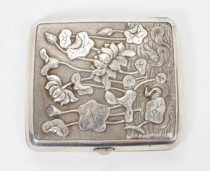 Late 19th/early 20th century Chinese white metal cigarette case, the cover with raised floral decora