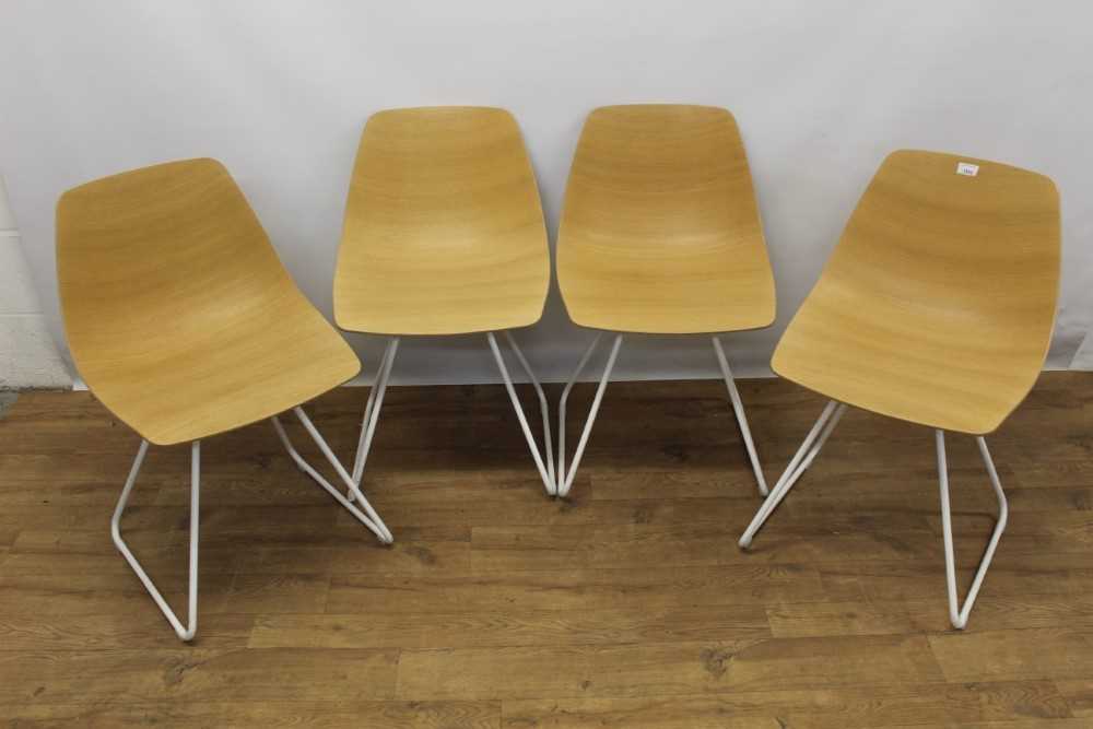 Set of four Lapalma sled base bent ply chairs designed by Antti Kotilainen