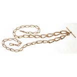 A heavy Edwardian 9ct rose gold watch chain with graduated links, 64cm length.