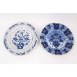 Two 18th century blue and white Dutch delftware dishes, one painted with the Peacock pattern, the ot