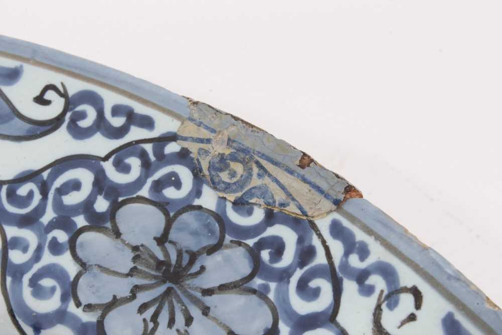 A blue and white Dutch delftware dish, circa 1700, painted in the Oriental style with birds amongst - Image 4 of 9