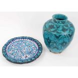 An Eastern turquoise-glazed pottery vase, 27cm high, and a similar dish painted with flowers (2)