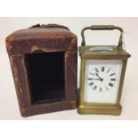 Early 20th century French brass carriage clock with striking movement with gong 17cm high in leather