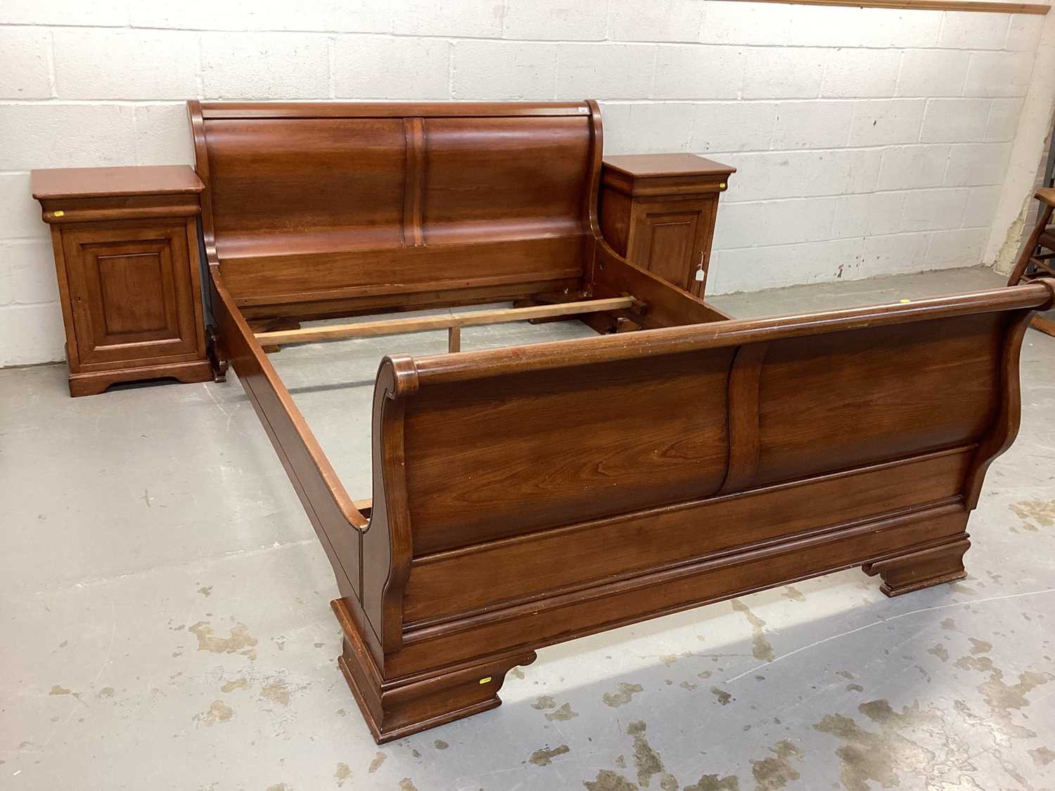 Contemporary cherrywood sleigh bed and matching bedside cabinets purchased from John Lewis