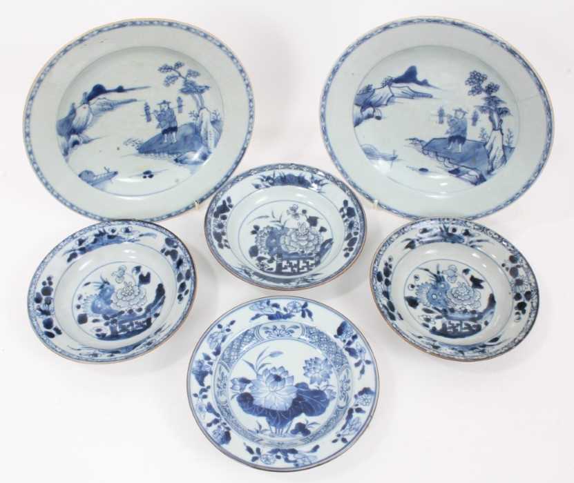 Four 18th Chinese export blue and white pudding bowls and two plates