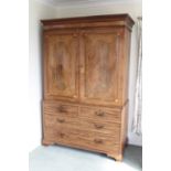 19th century inlaid mahogany linen press, the dentil cornice above twin inlaid panelled doors enclos