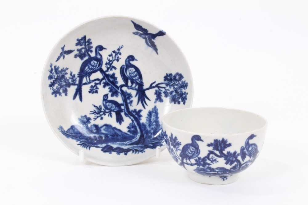 A Worcester blue and white tea bowl and saucer, circa 1770-85, printed with the Birds in Branches pa