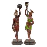 Pair of 19th century cold painted spelter figural candlesticks, in the form of Africa and America