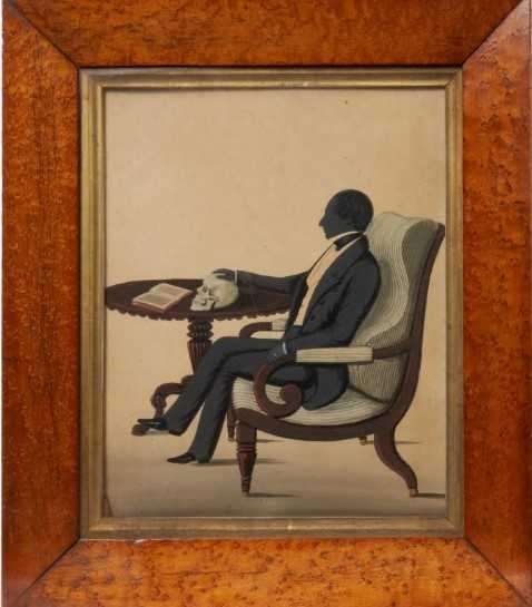 Unusual Regency silhouette portrait, with skull on the table, in birds eye maple frame.