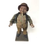 Early 20th century advertising automaton in the form of a portly man smoking, with glass eyes
