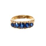 Late Victorian sapphire five stone ring with five oval mixed cut blue sapphires with diamond accents