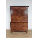 George III Welsh oak two height panelled livery cupboard, the upper section enclosed by the fielded