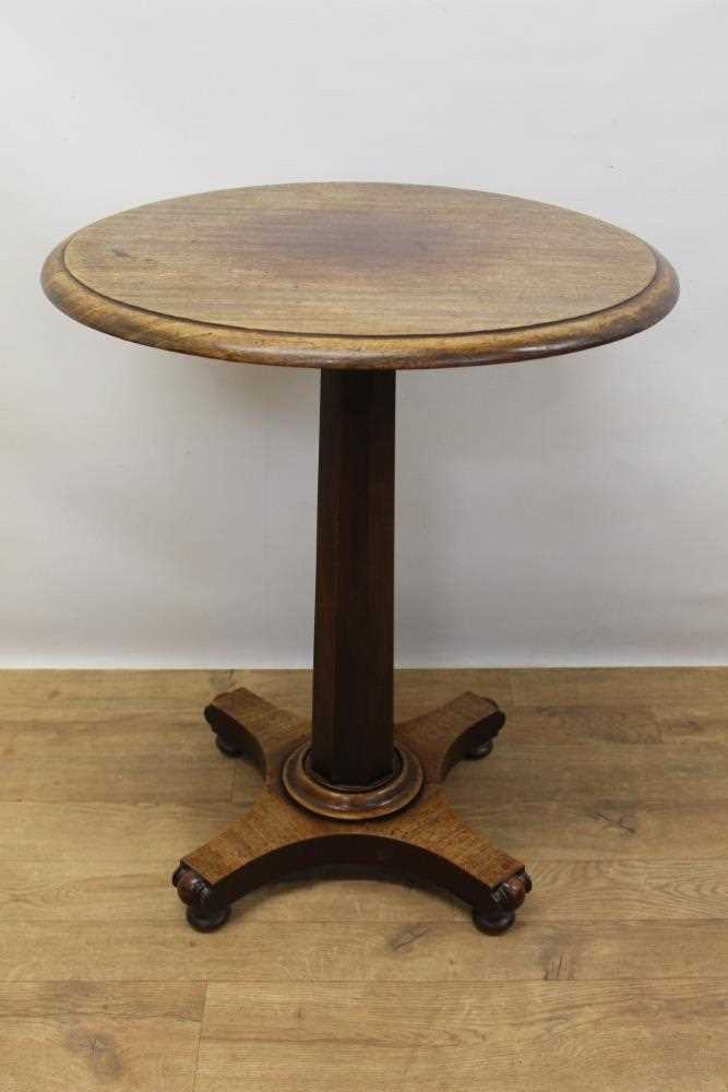 Early 19th century mahogany lamp table with circular top table standing on octagonal column and pla