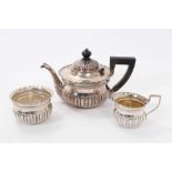 Three piece silver batchelors teaset, squat form with half fluted body.