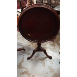 Mahogany tilt top wine table with gallery decoartion