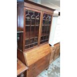 Edwardian mahogany bureau bookcase with shelves above enclosed by two glazed doors, fitted interior